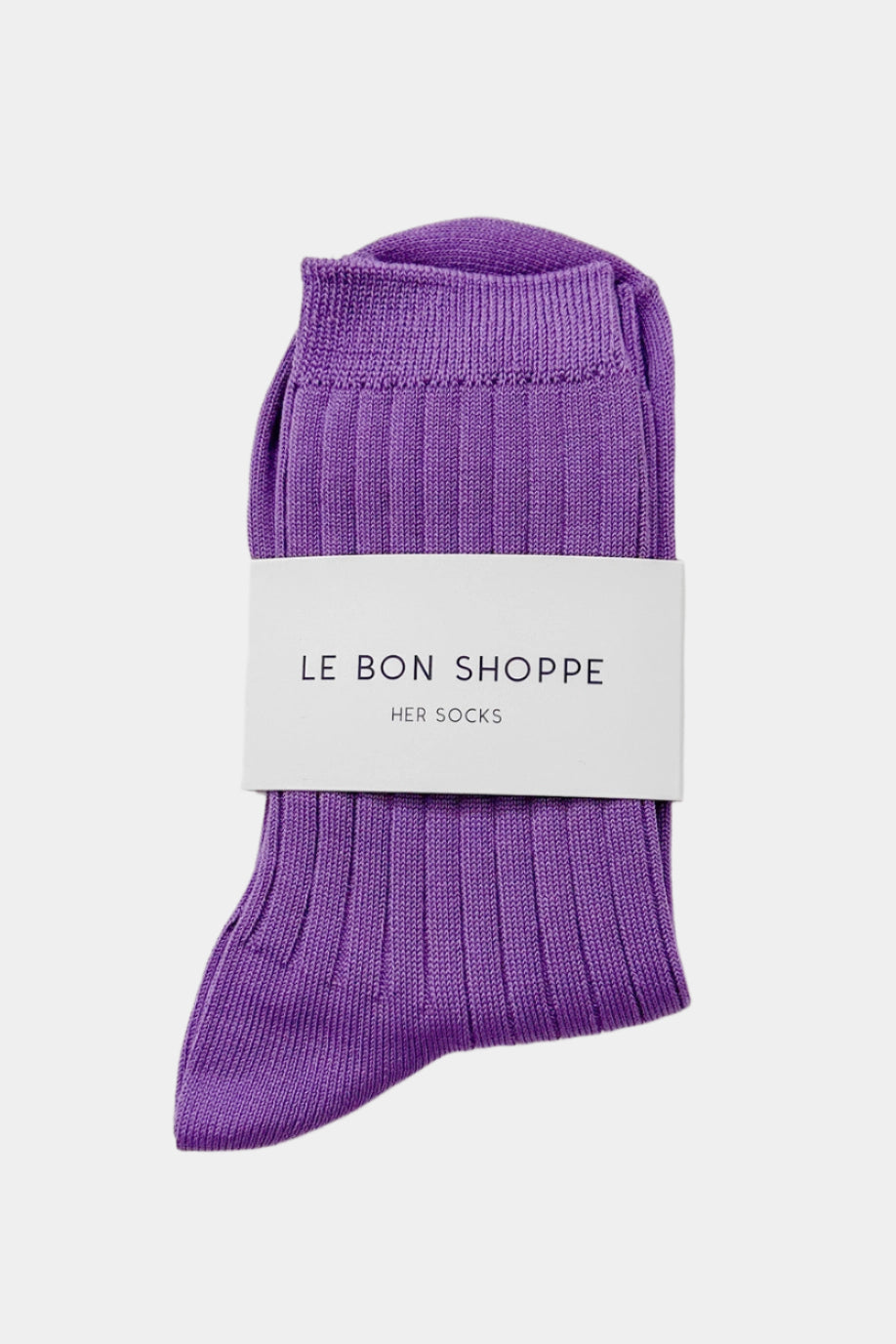 Her socks in violet colour with branded paper band