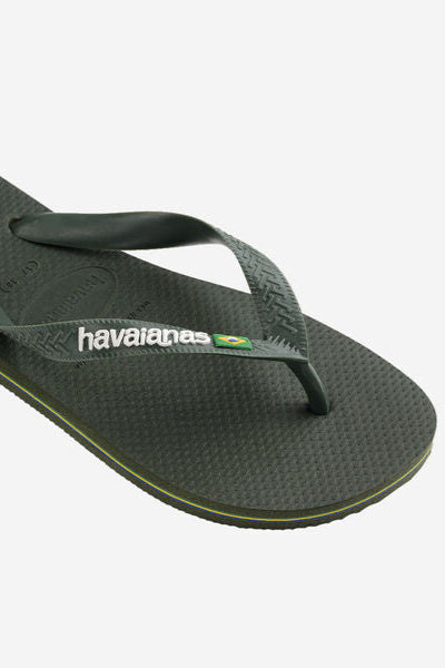 Green Havaianas sandal on a white background