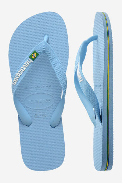 Light blue flip-flop sandal with 'havaianas' logo on a white background