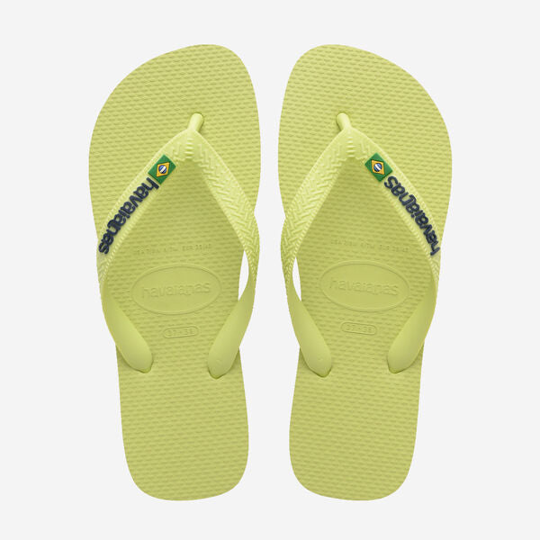 Pair of matcha green flip-flops with brand logo on a white background
