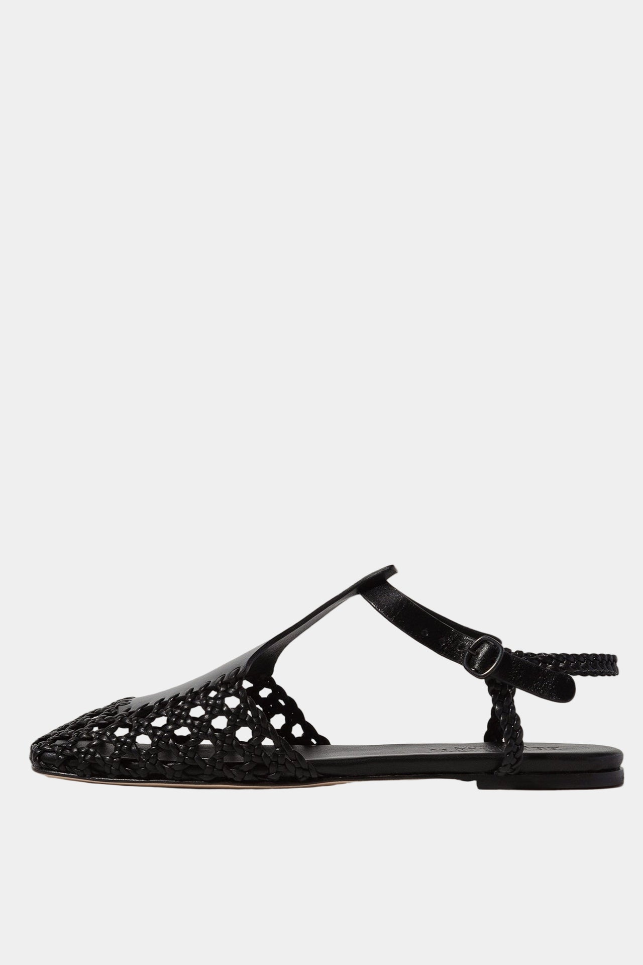 A pair of black square-toed sandals with a t-bar strap and hand-woven design, featuring a combination of veg-tanned calf leather and supple lamb skin, with a rubber heel.