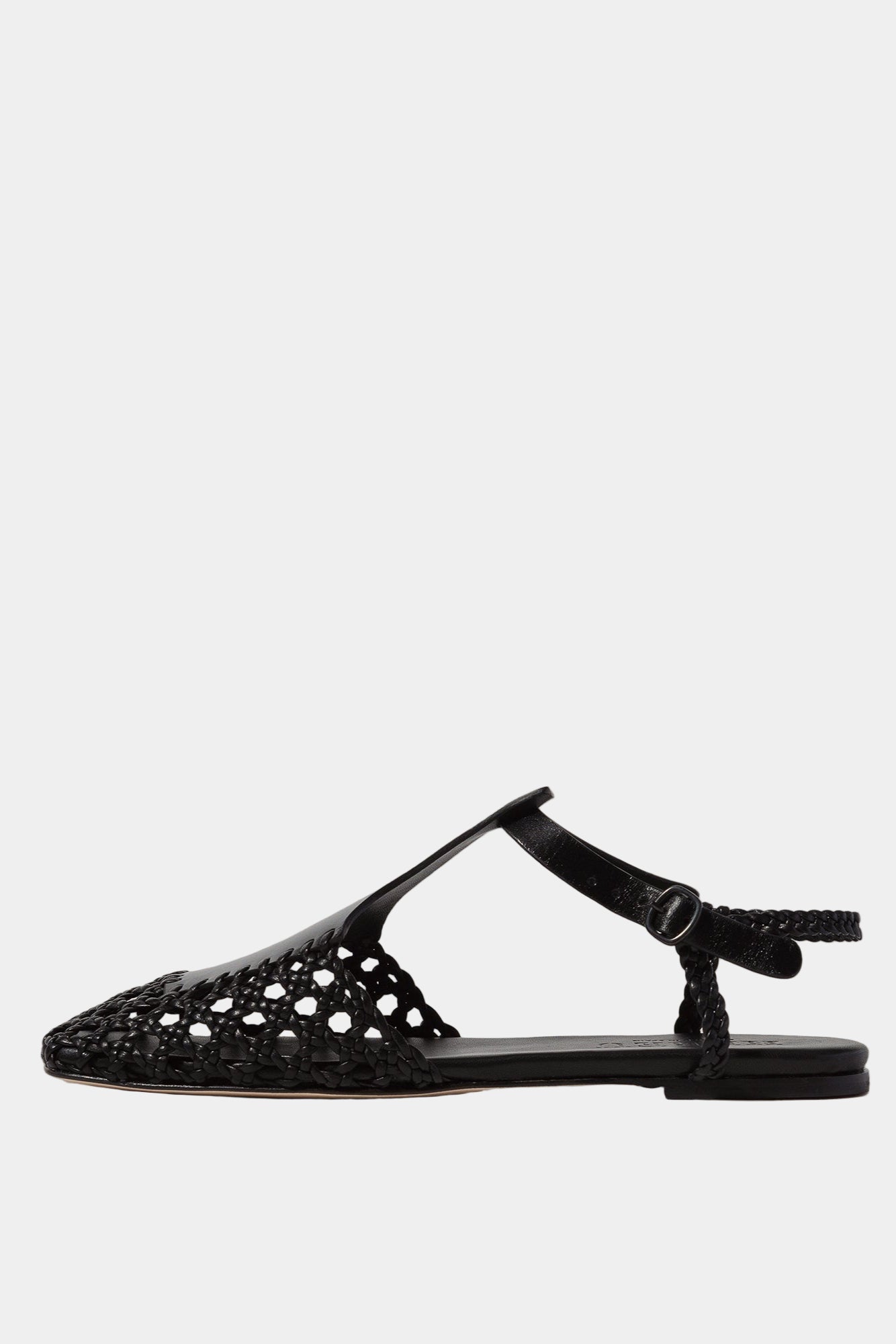 Black flat sandal with cut-out design on a white background