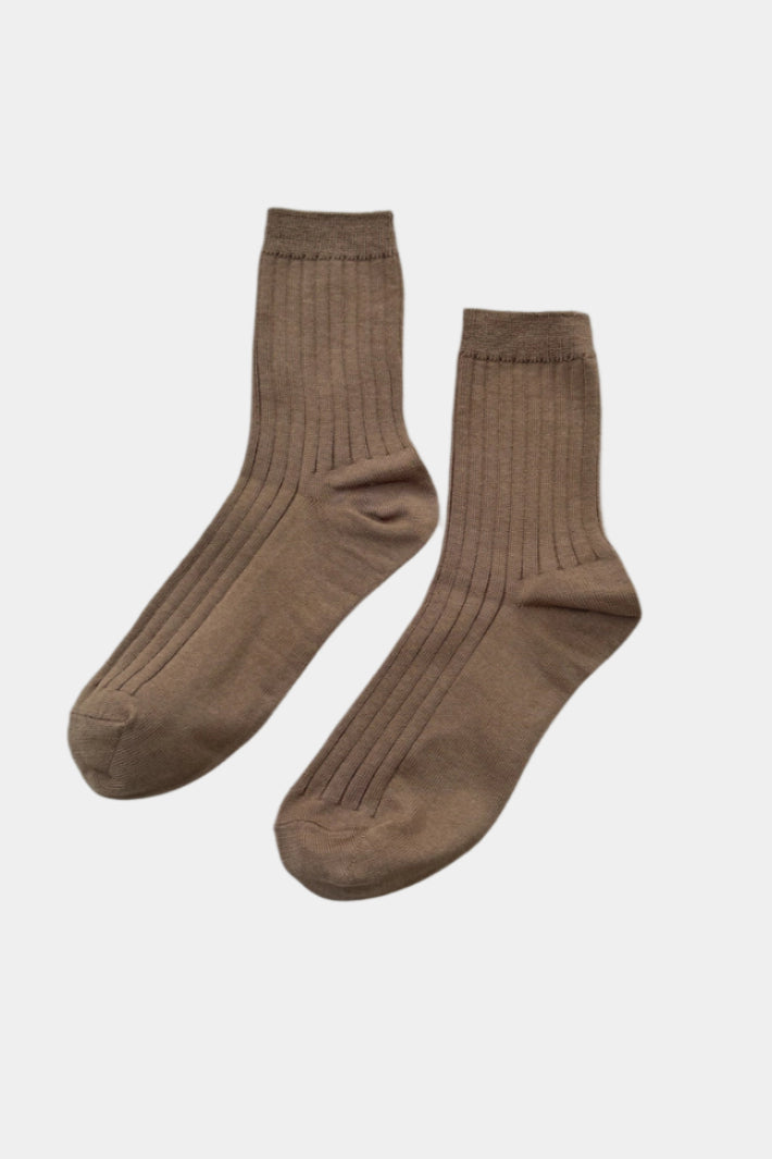 her socks in dark tan, with branding paper band