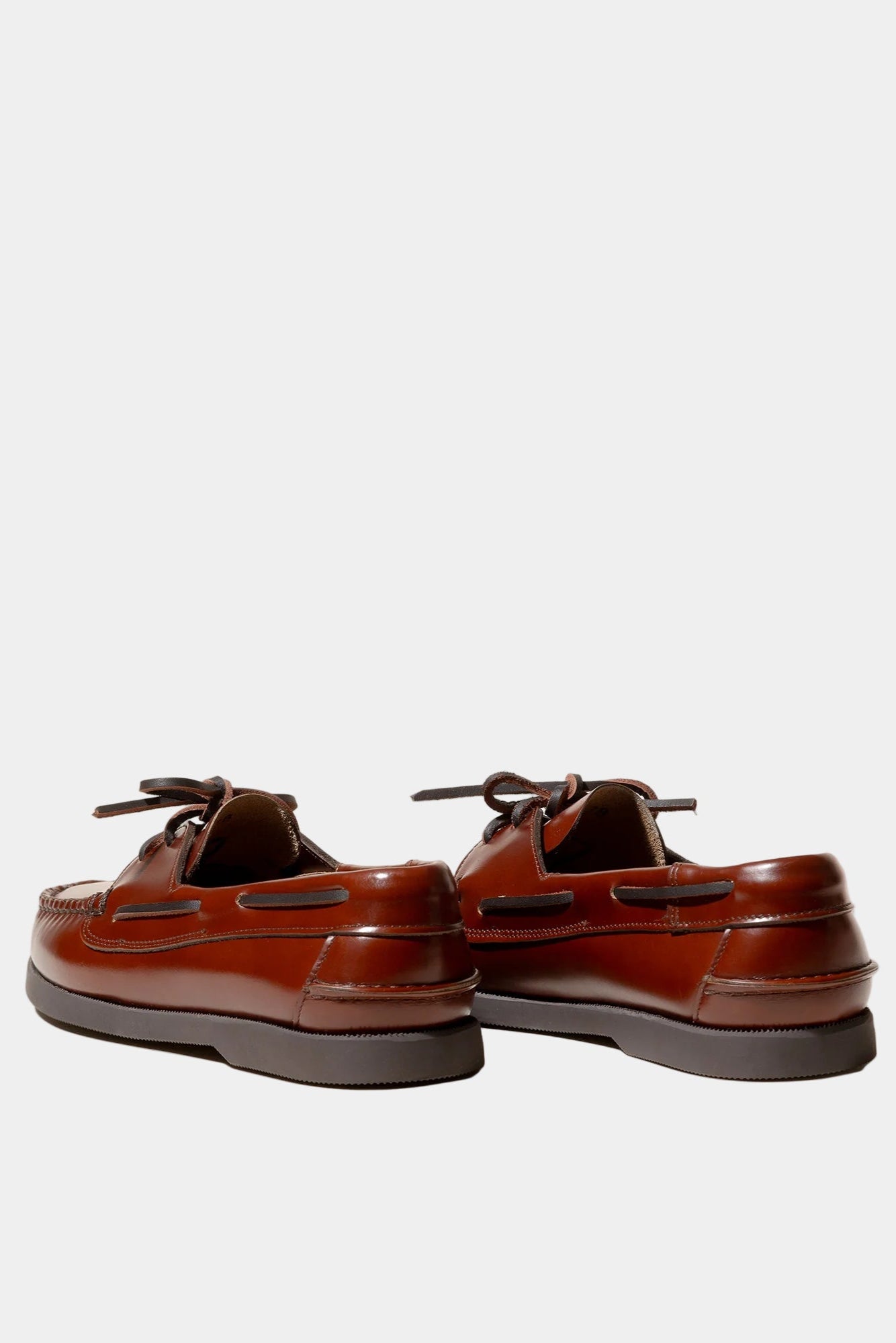 Pair of brown leather shoes on a white background