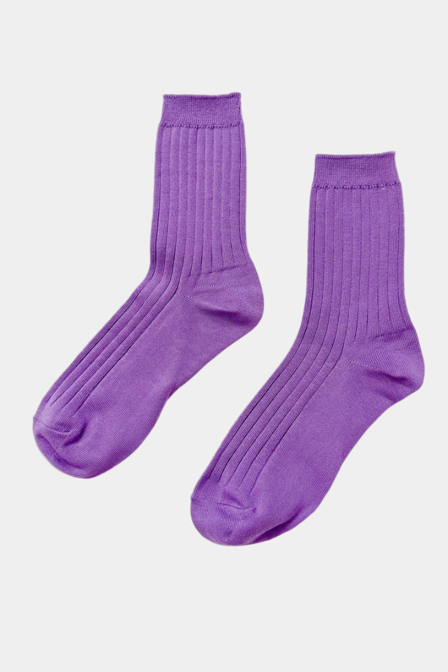 Her socks in violet colour with branded paper band
