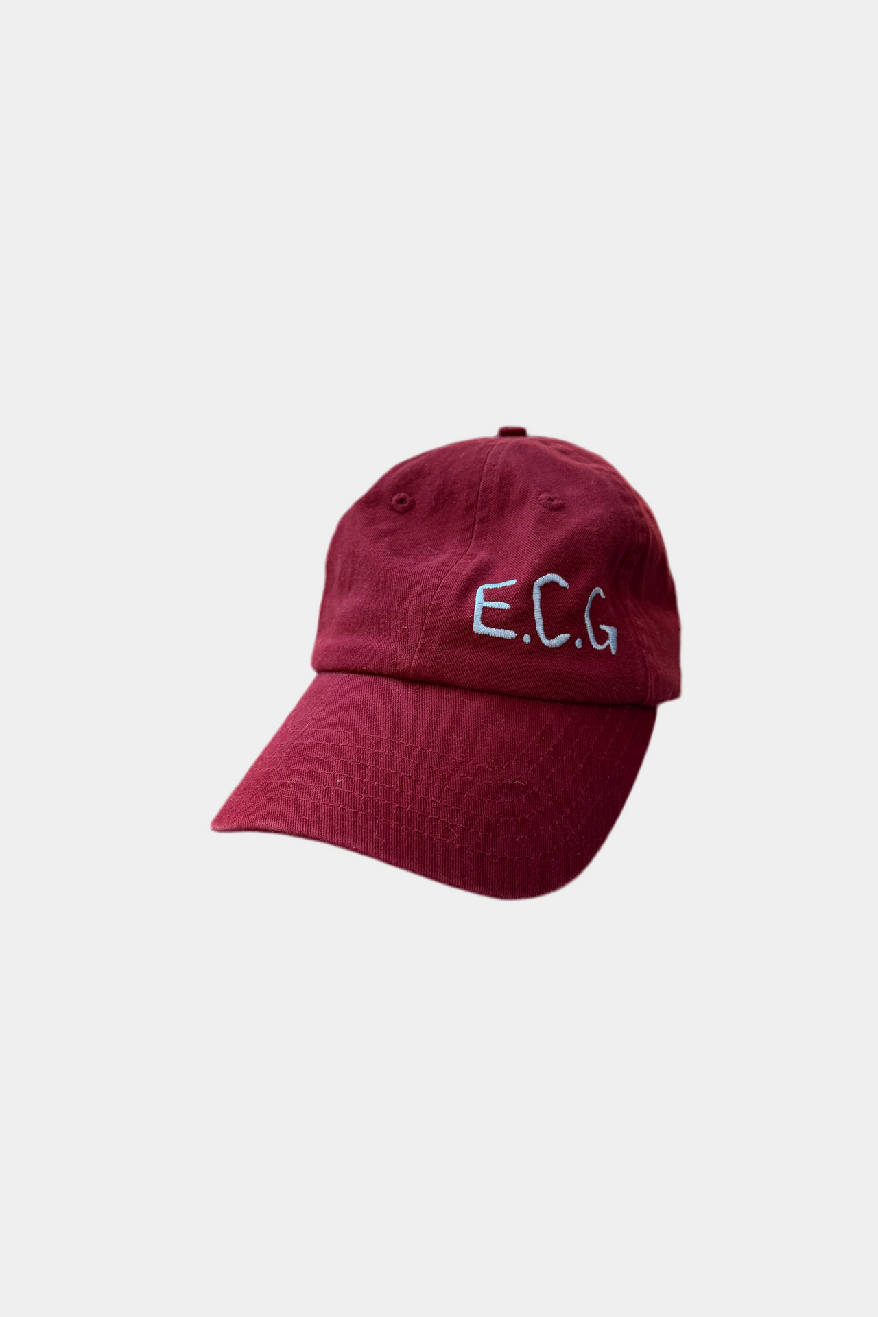 Burgundy cap with 'E.C.G.' embroidery on a white background
