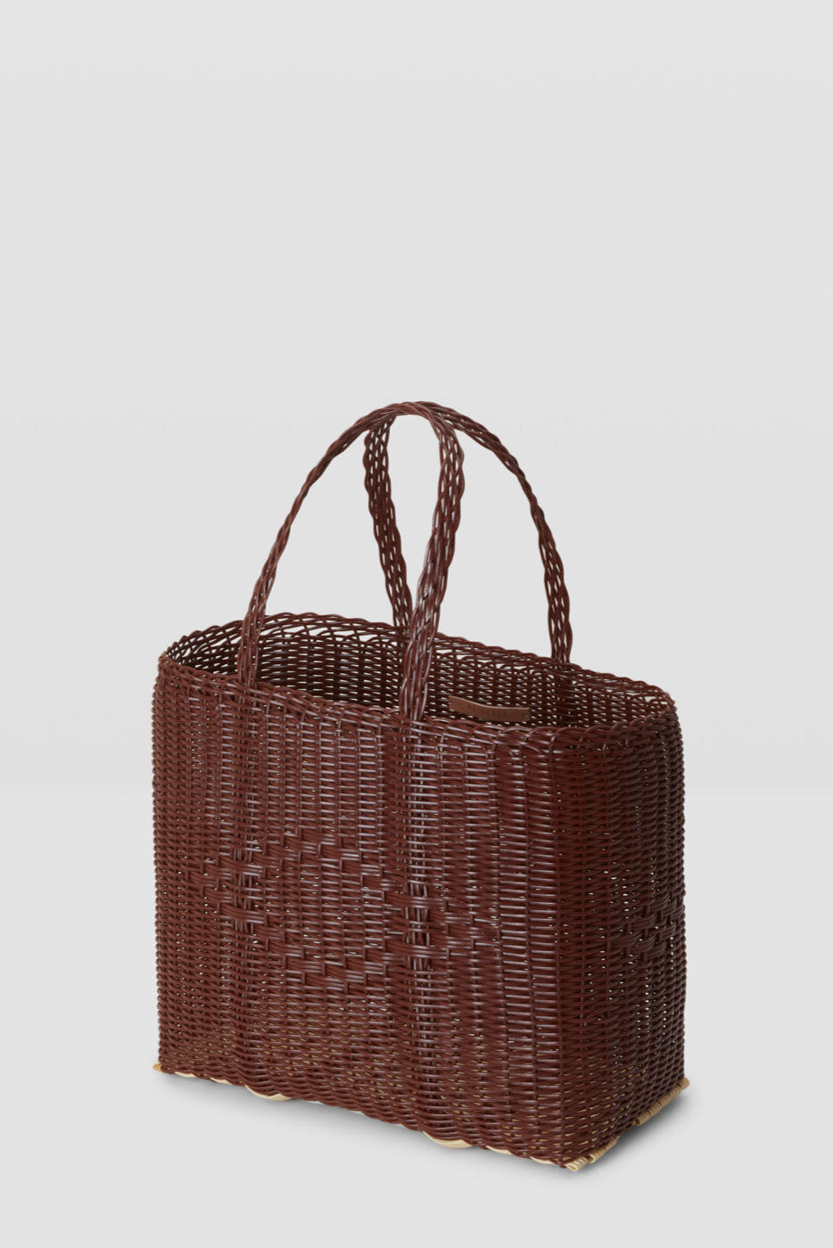 Woven brown handbag on a light gray background