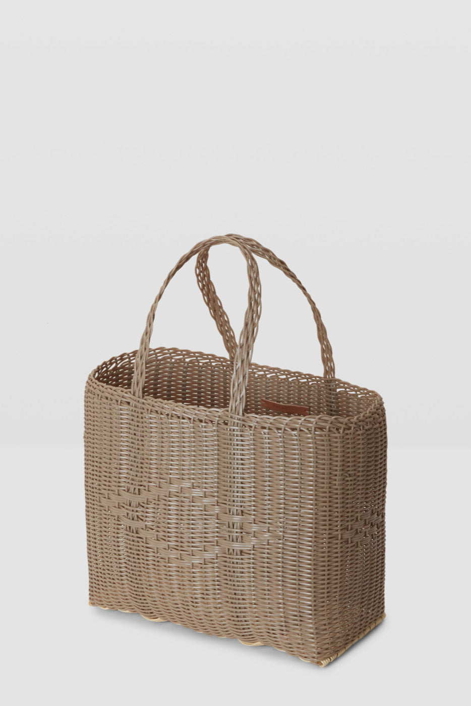 Woven handbag on a light gray background