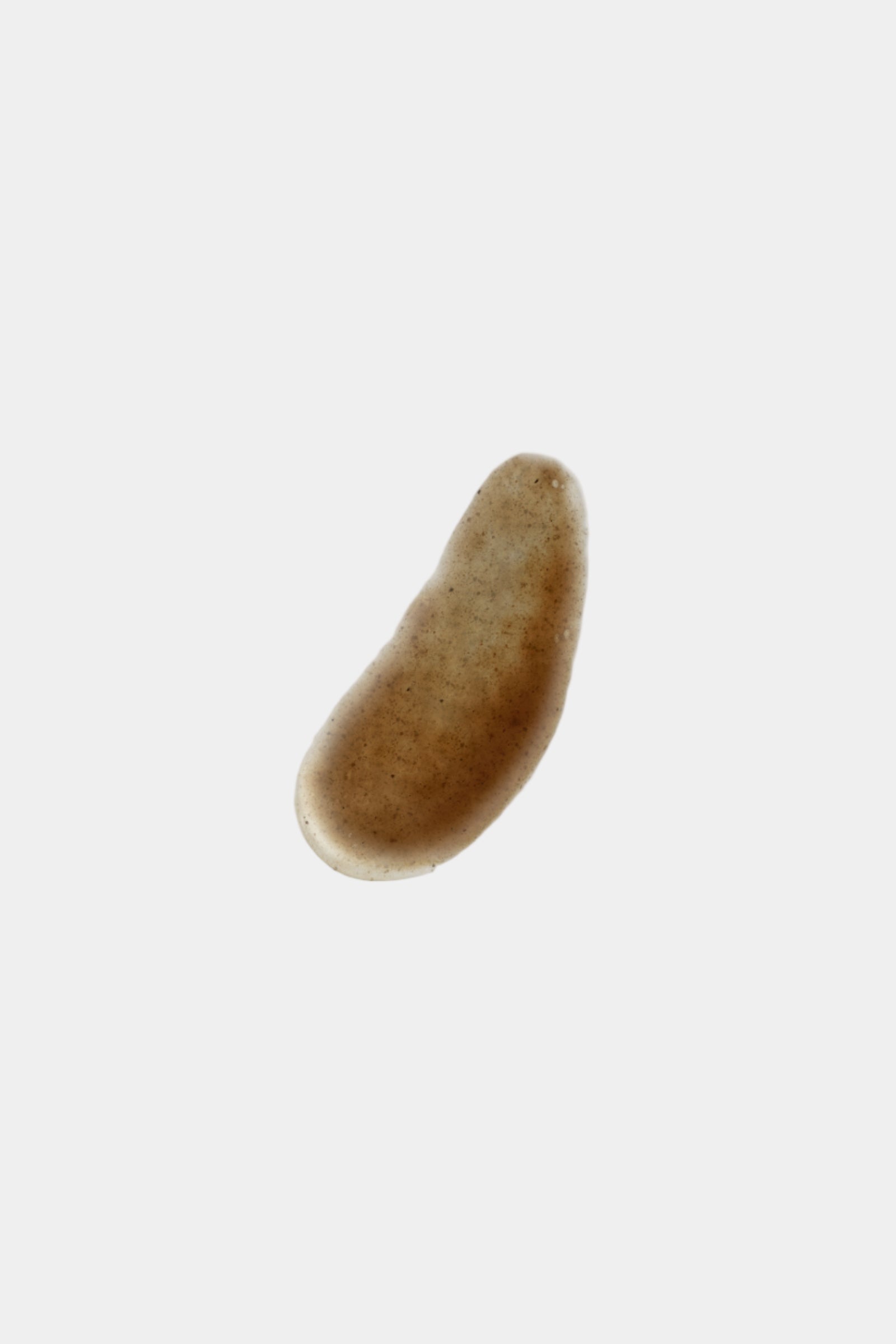 Brown oval object on a light gray background