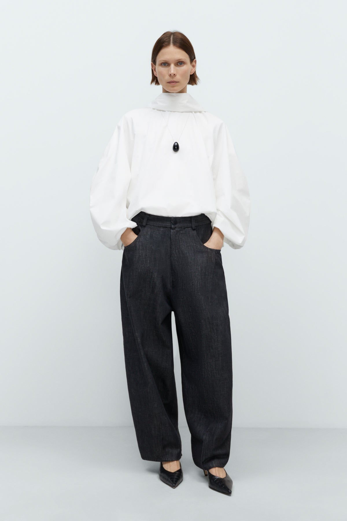 Dark gray jeans on a white background