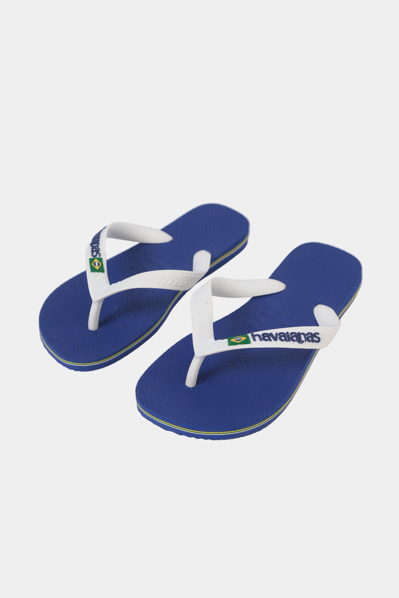 A pair of blue and white Havaianas flip-flops displayed against a white background.