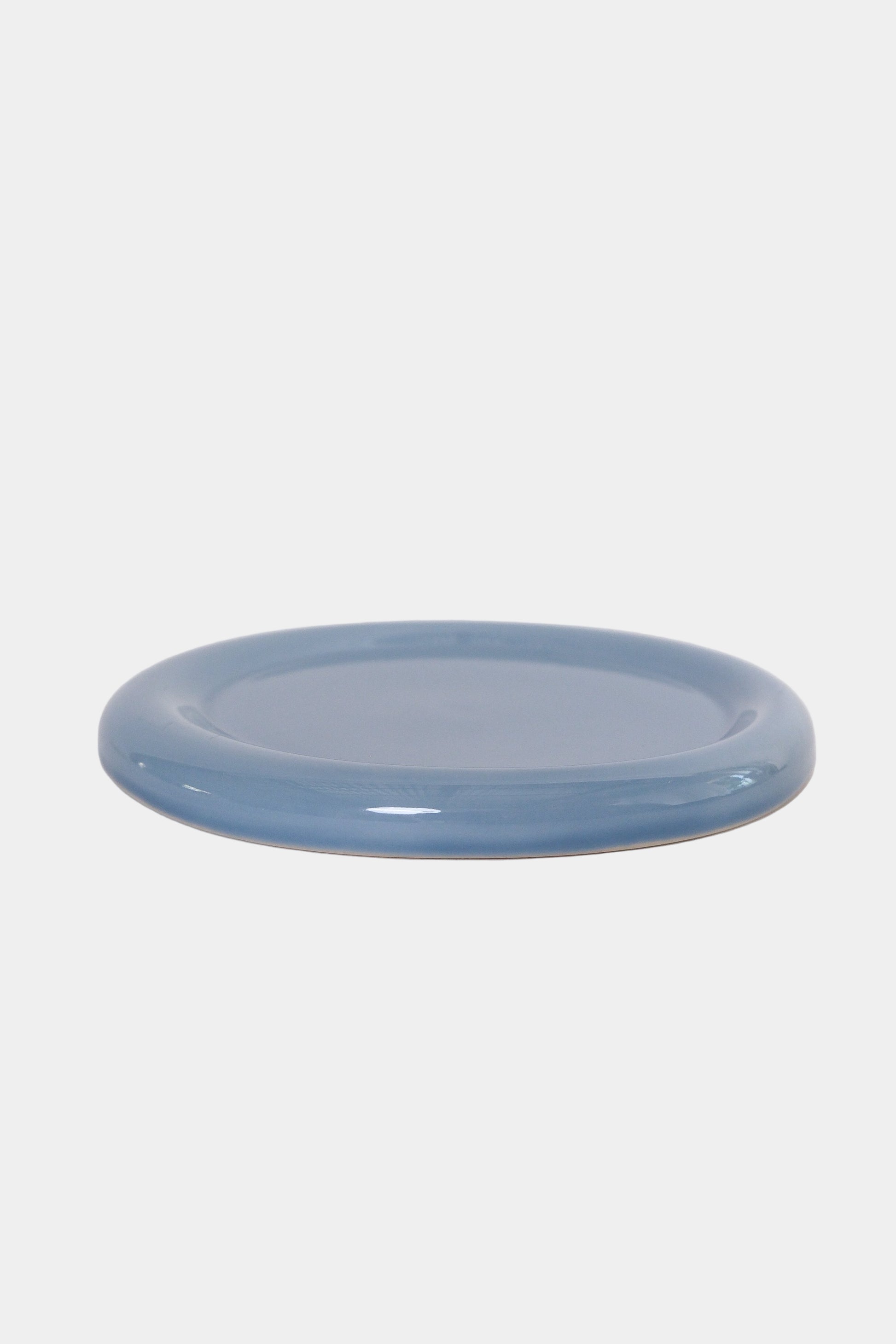 side view of snack plate in cornflower on a white background