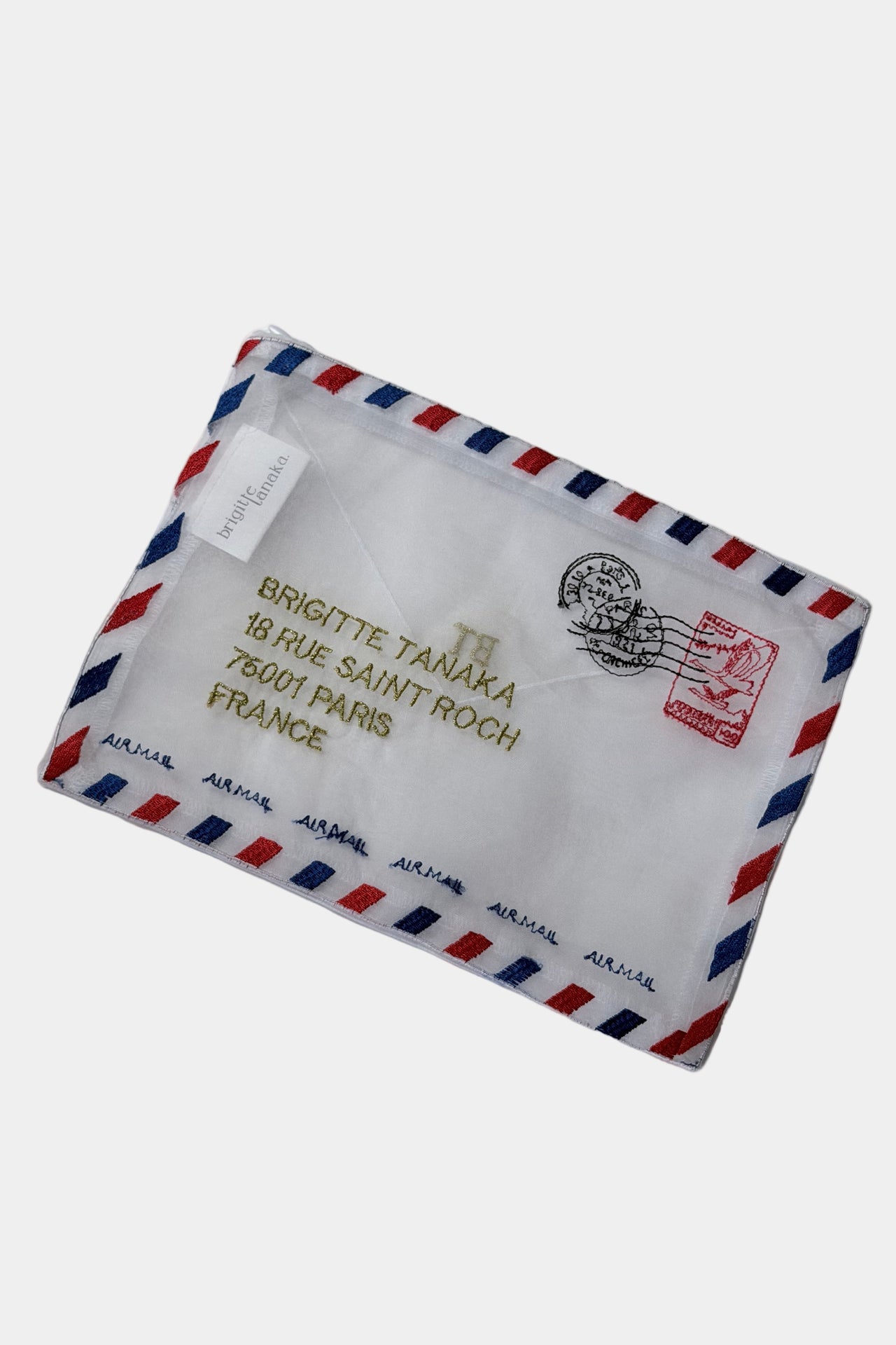 Embroidered envelope style pouch with airmail design and text on a white background