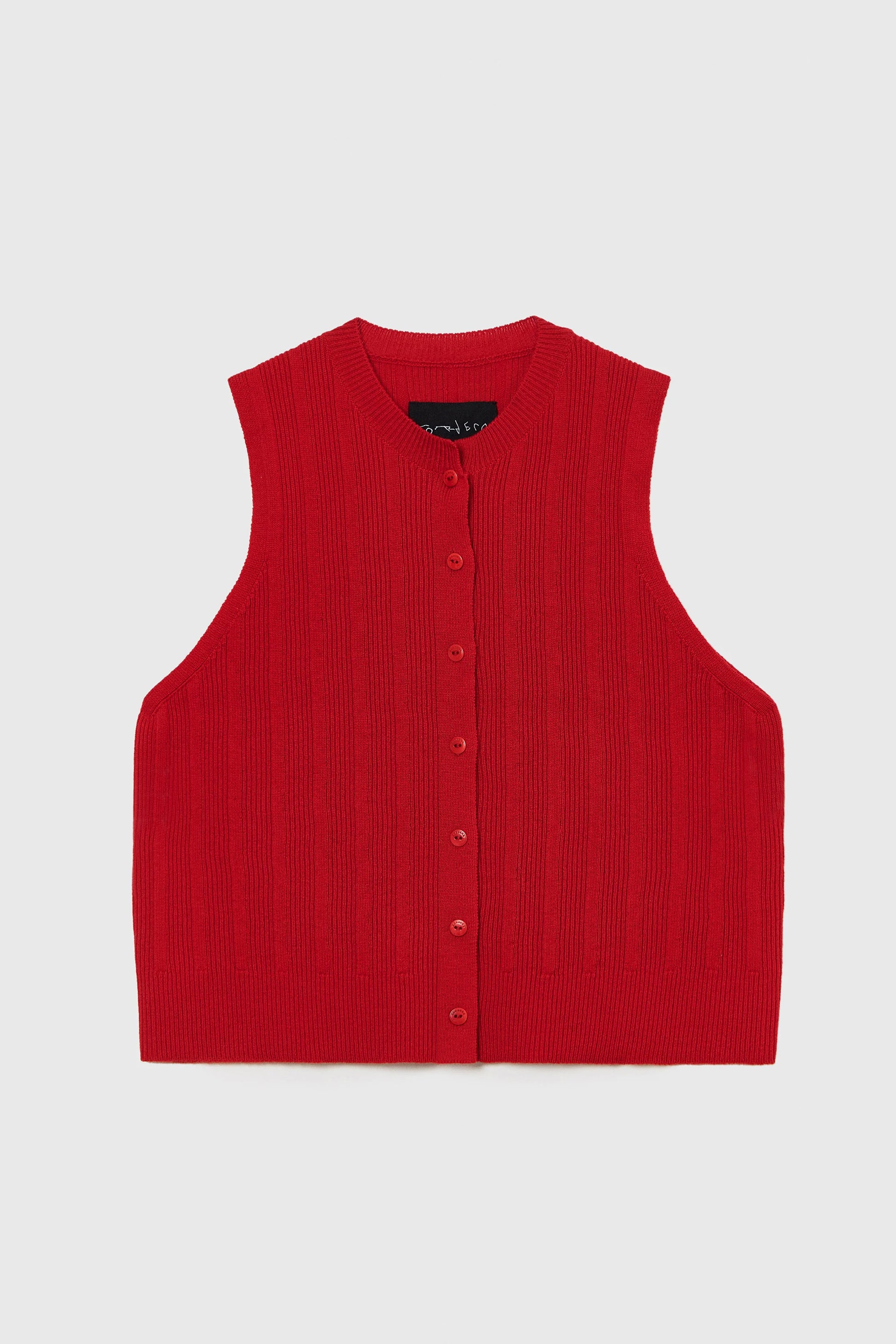 Red vest with buttons on a light gray background