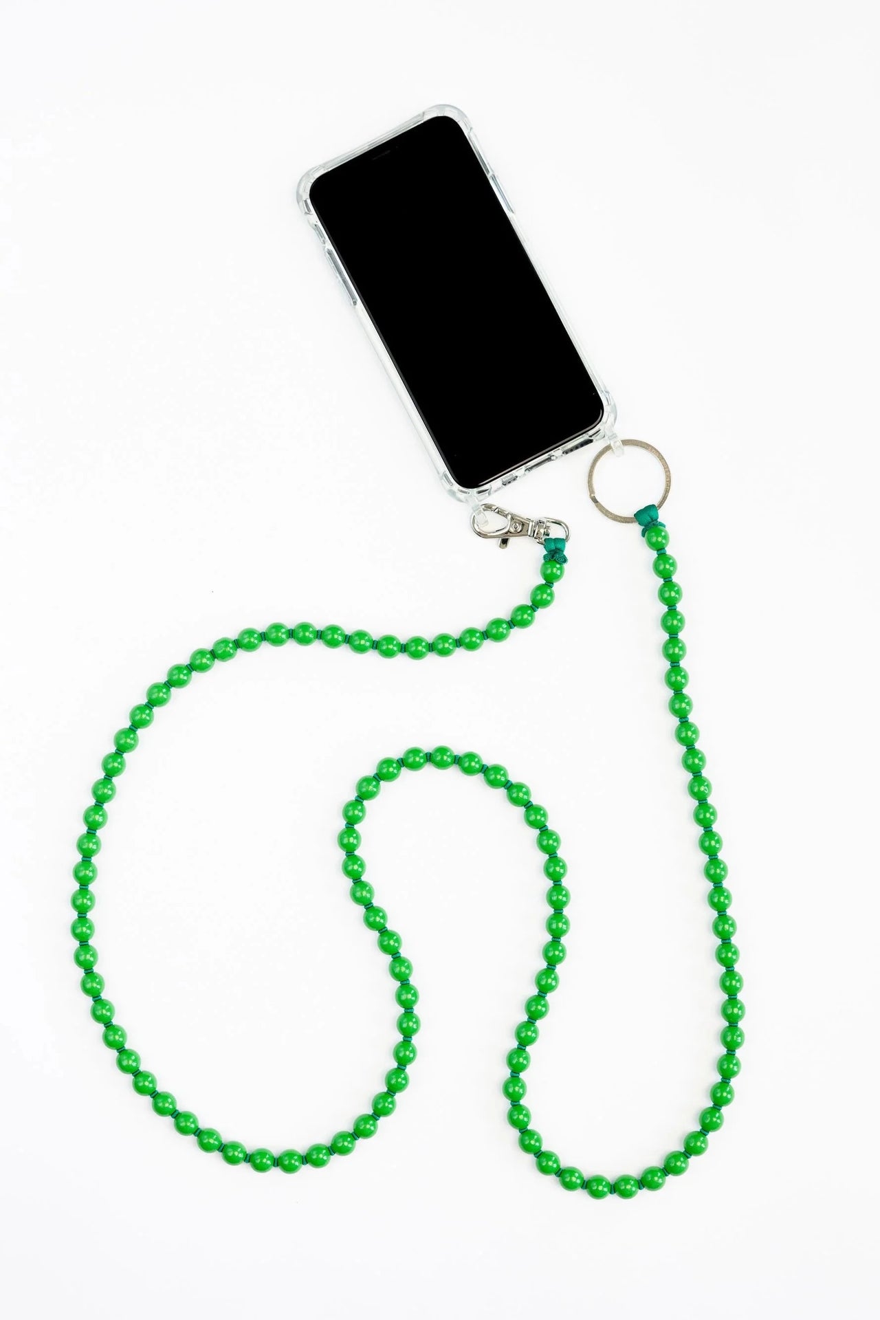 Smartphone with a green beaded lanyard on a white background