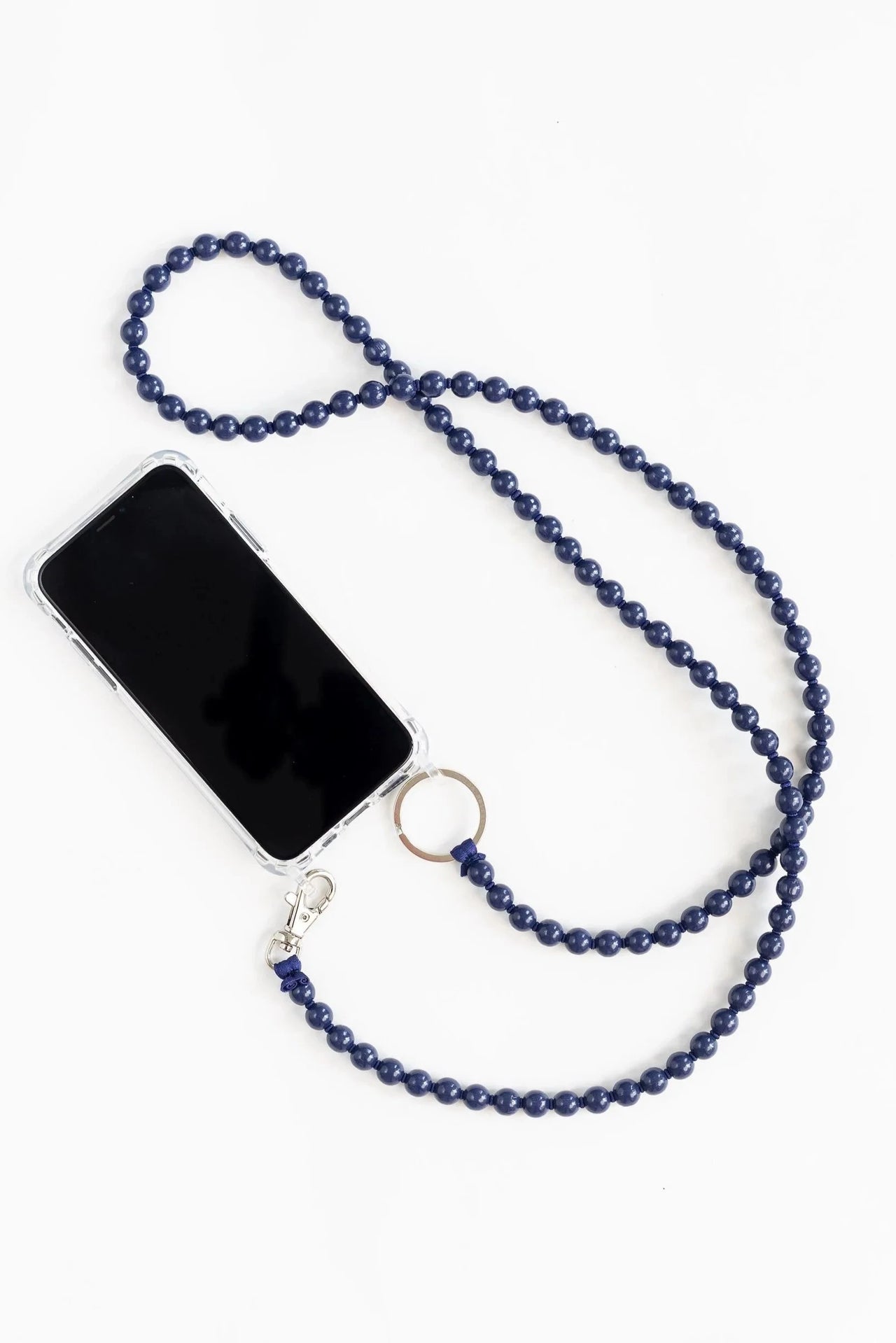 Phone case with blue beaded necklace on a white background