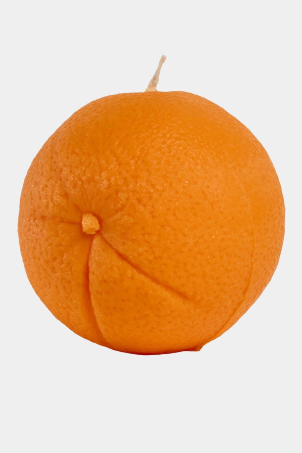 Orange candle on a white background