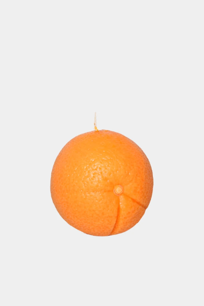 Orange candle on a white background