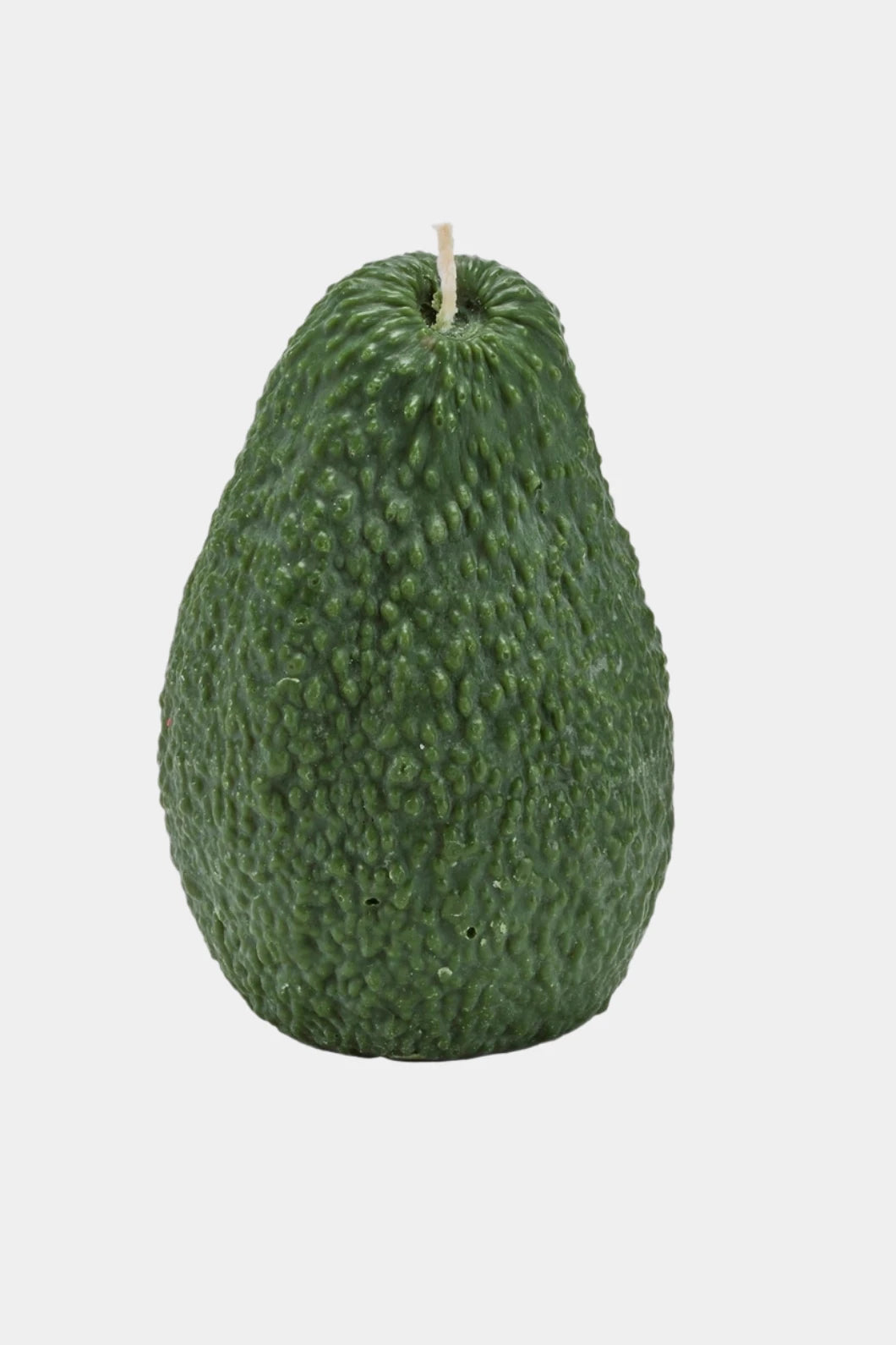 Green avocado candle on a white background
