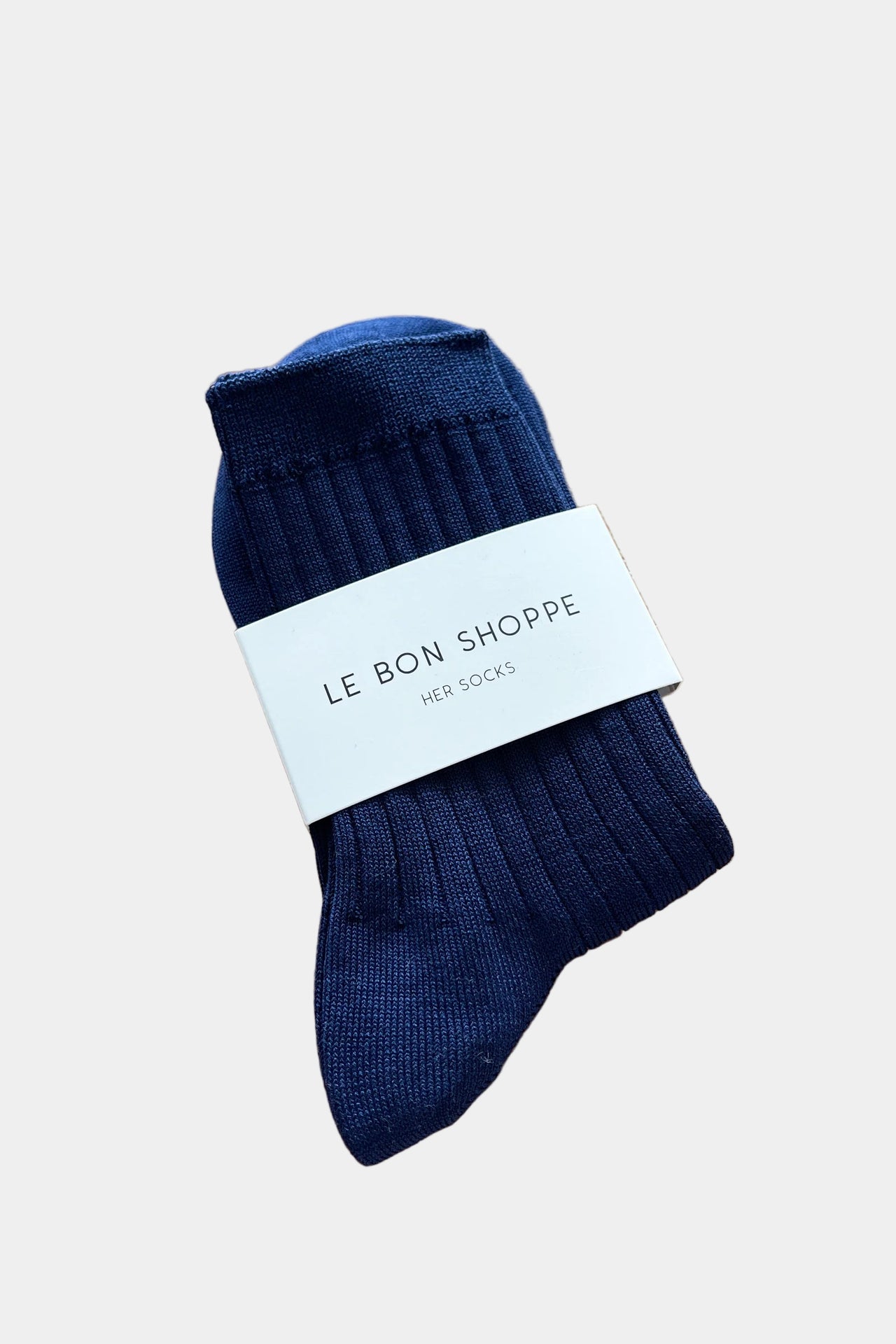 Pair of blue socks on a white background