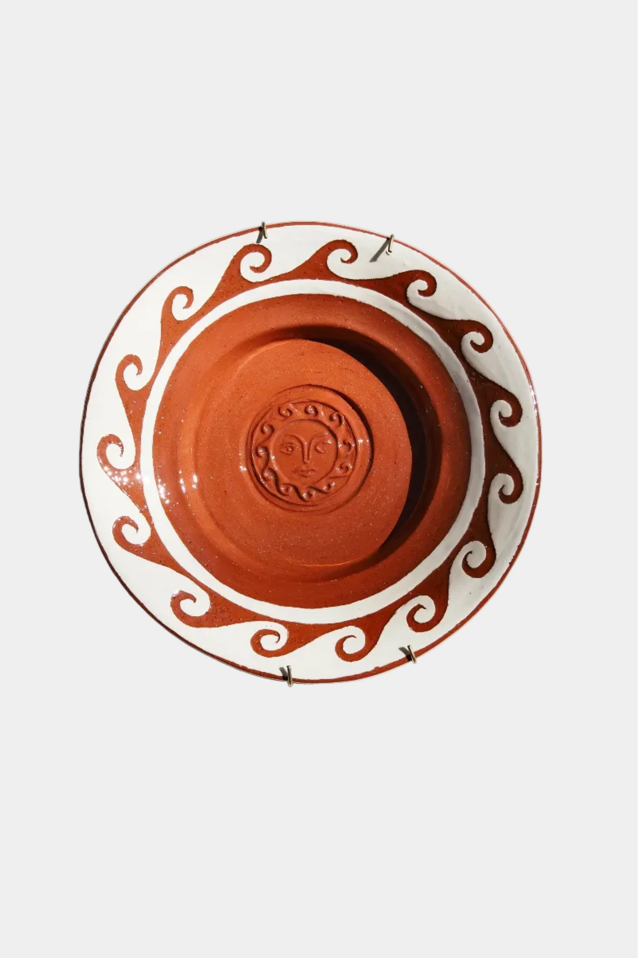 Terracotta pot with decorative patterns on a white background