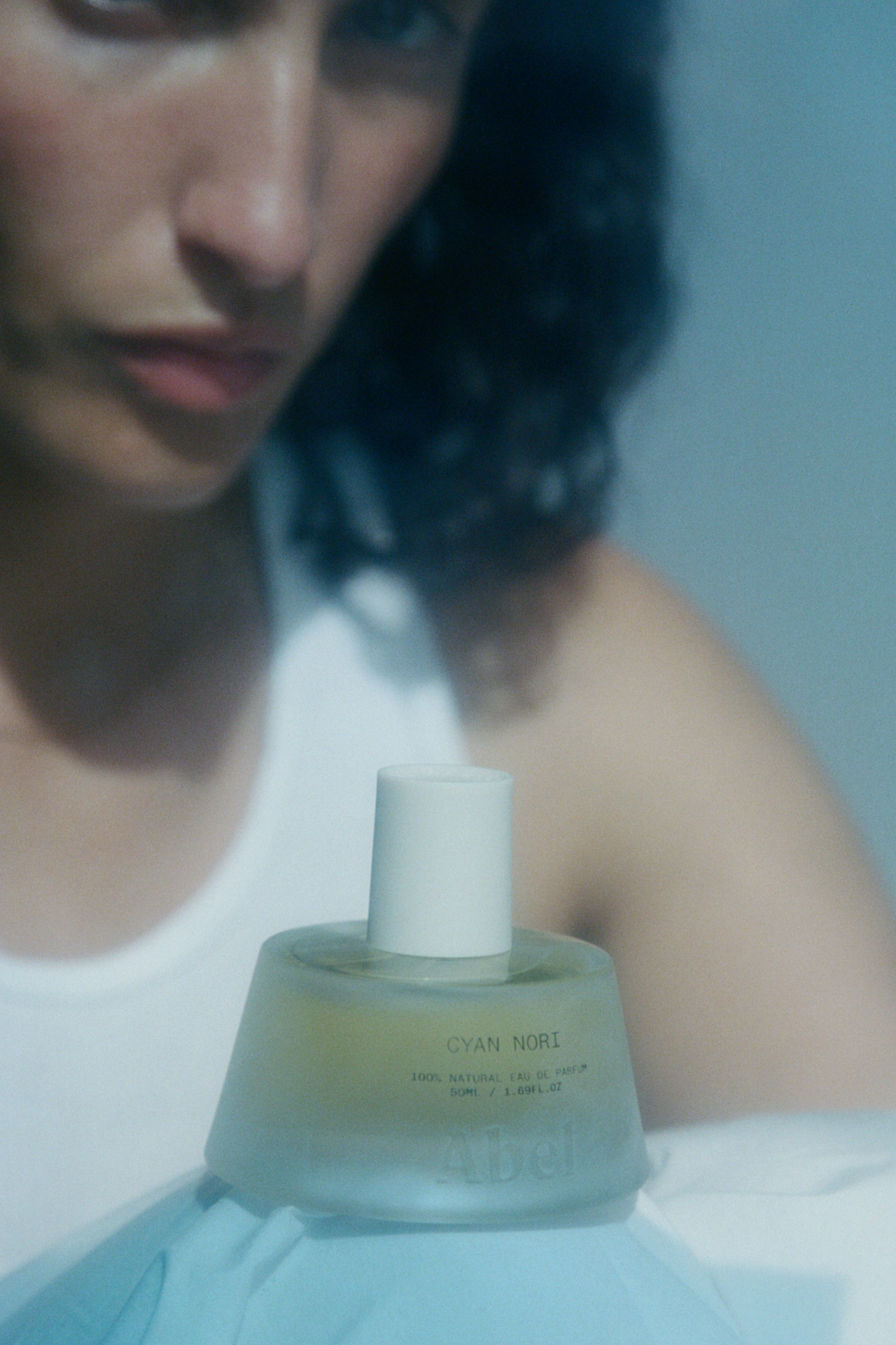 Perfume bottle labeled 'Cyan Nori' on a white background