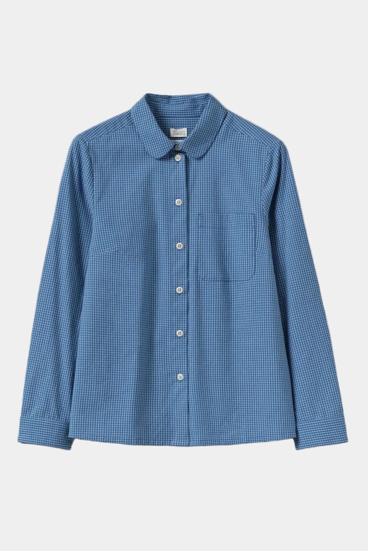 Blue checkered shirt on a light gray background
