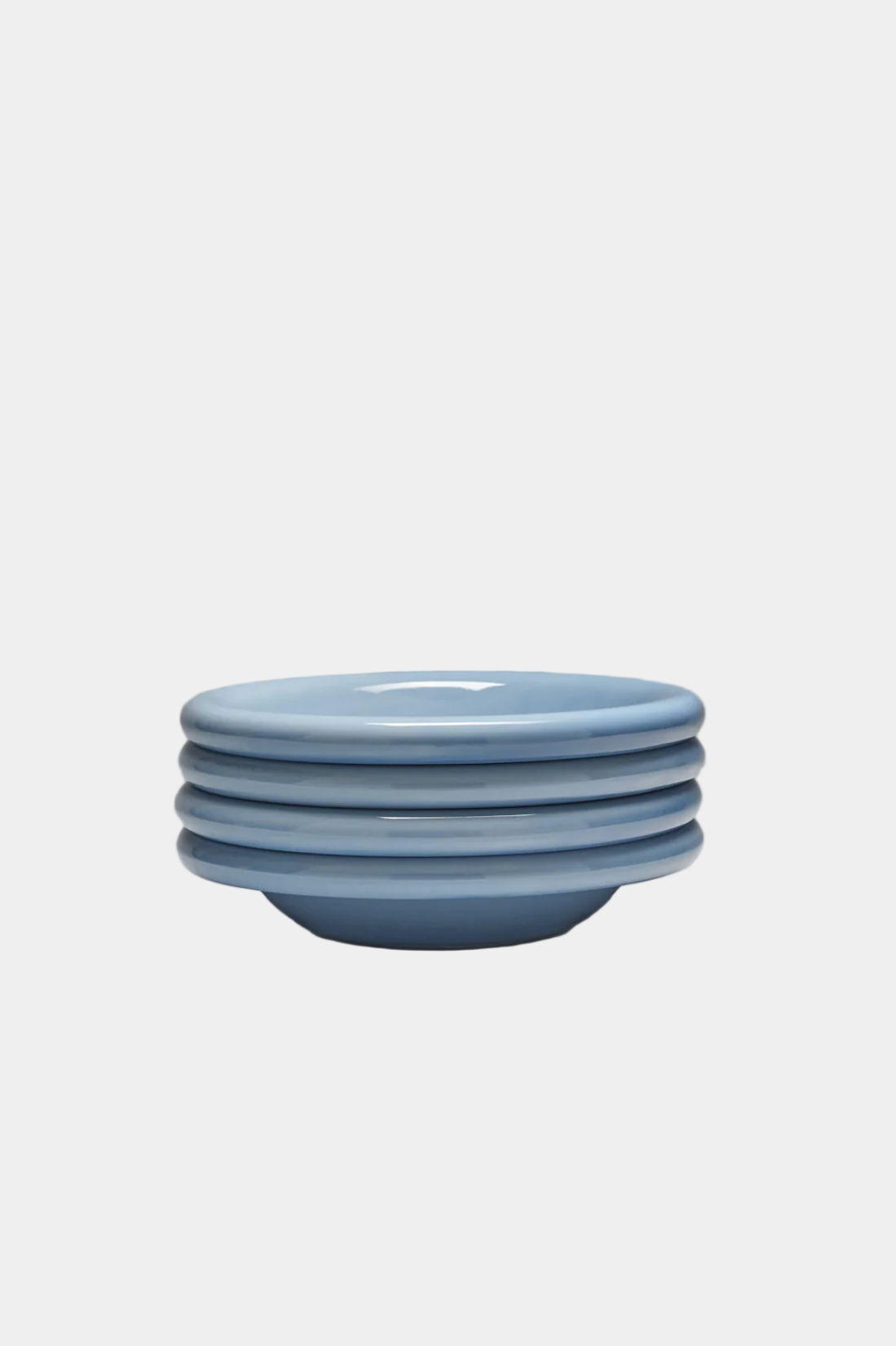 Stack of blue ceramic bowls on a white background