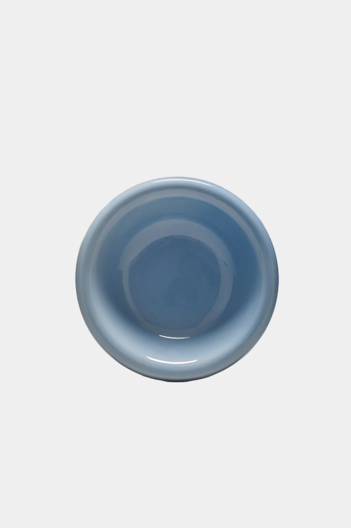 Light blue ceramic bowl on a white background, viewed from above