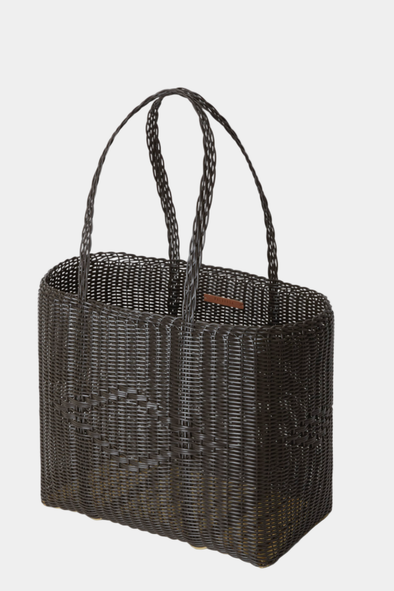 Dark brown woven tote bag on a light gray background