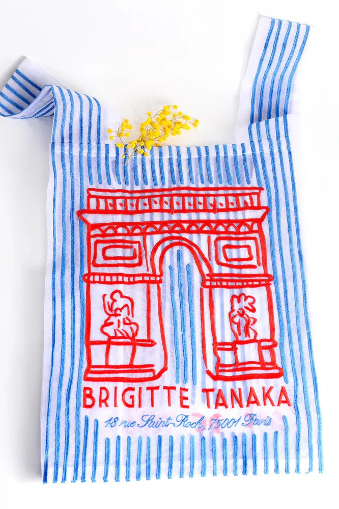 Striped bag with a red design and text on a white background