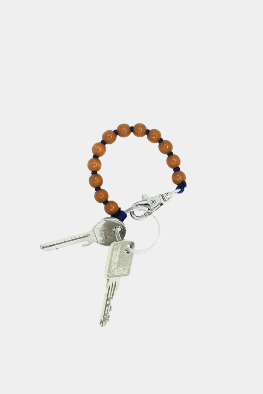 Keychain with beads and keys on a white background