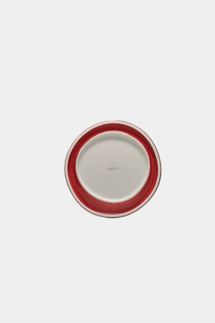 underneath view of snack plate in tomato red on white background