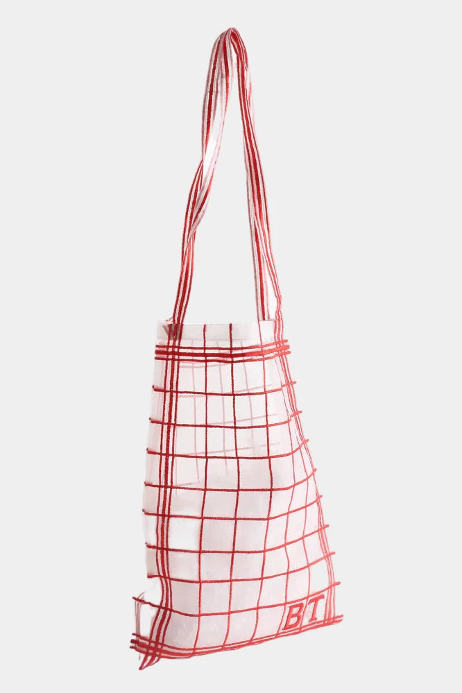 red embroidered check bag with a milk bottle on a white background