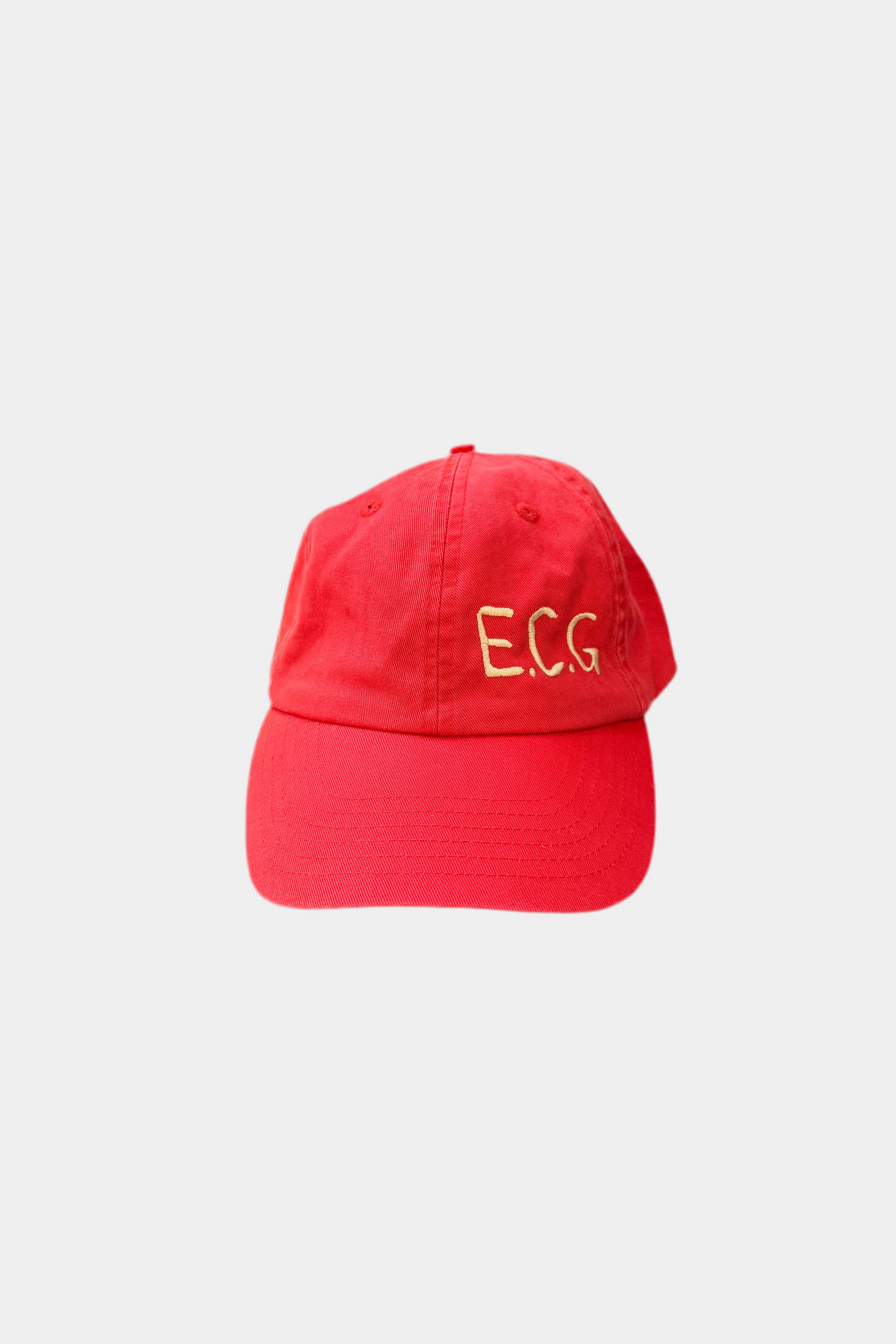Red cap with 'E.C.G.' text on a light gray background
