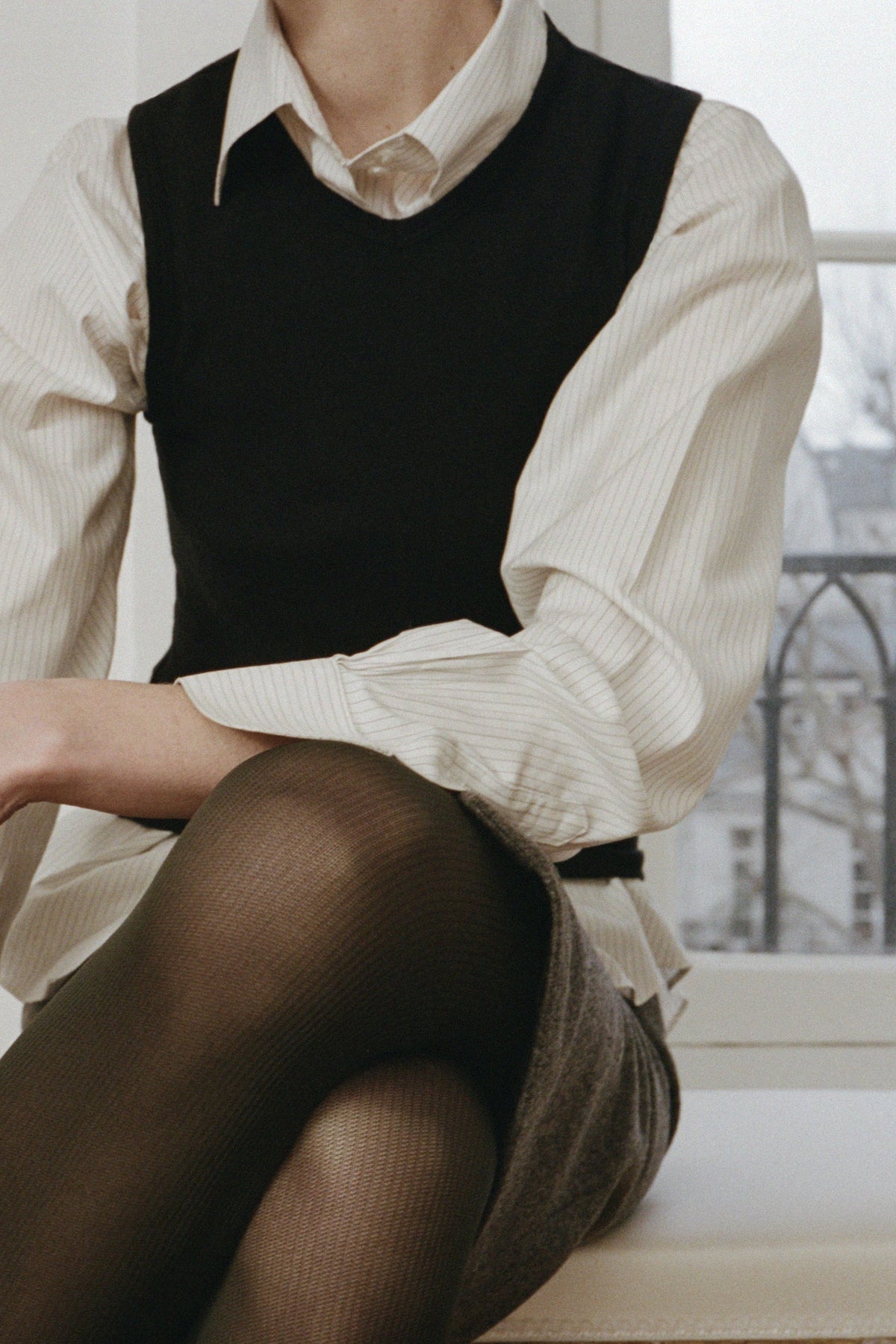 KYE Intimates Black Vest layered over a striped pinstripe shirt - East Coast General