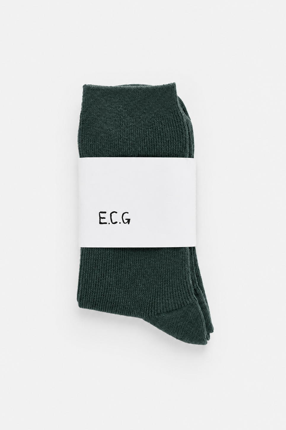 Green socks with a white ‘E.C.G’ label on a white background