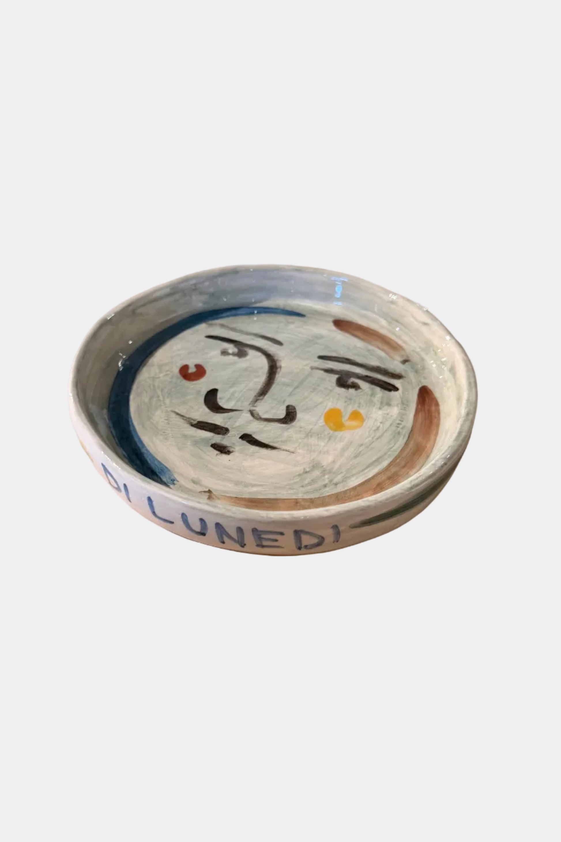 Round glass coaster with a design on a plain surface