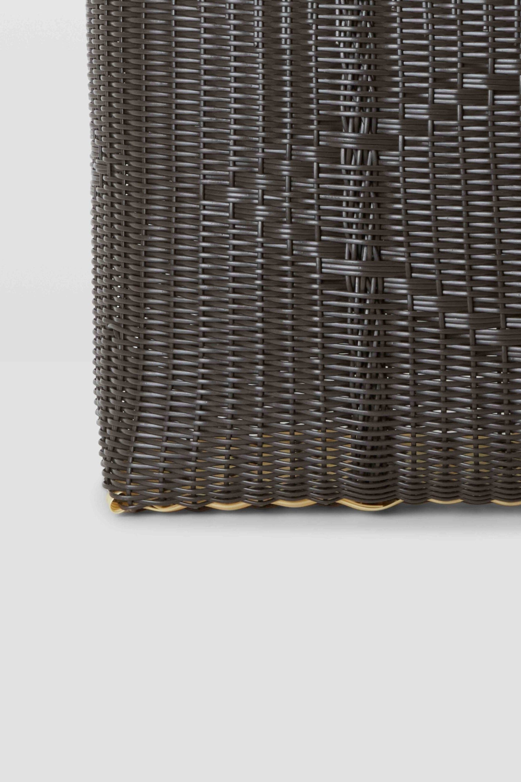 Dark woven mat on a light gray background