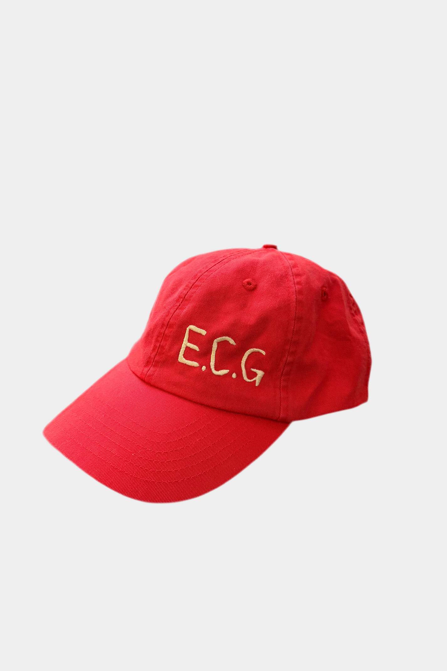 Red cap with 'E.C.G.' text on a light gray background