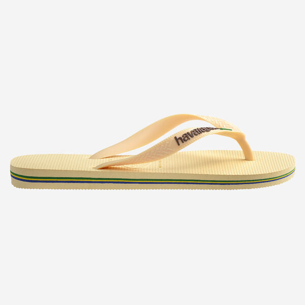 Yellow sandal with green and blue stripes on a white background