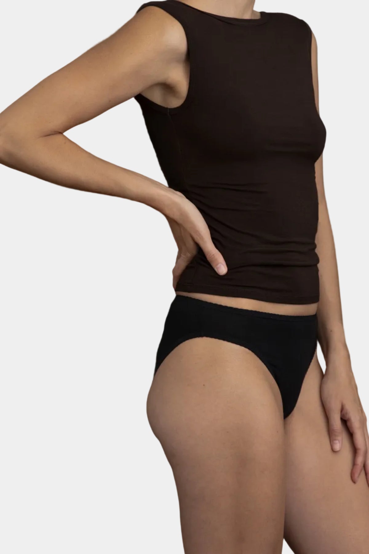 A model wearing Kye Intimates Recline Bateau sleeveless top in Espresso and recline briefs, viewed from the side - East Coast General