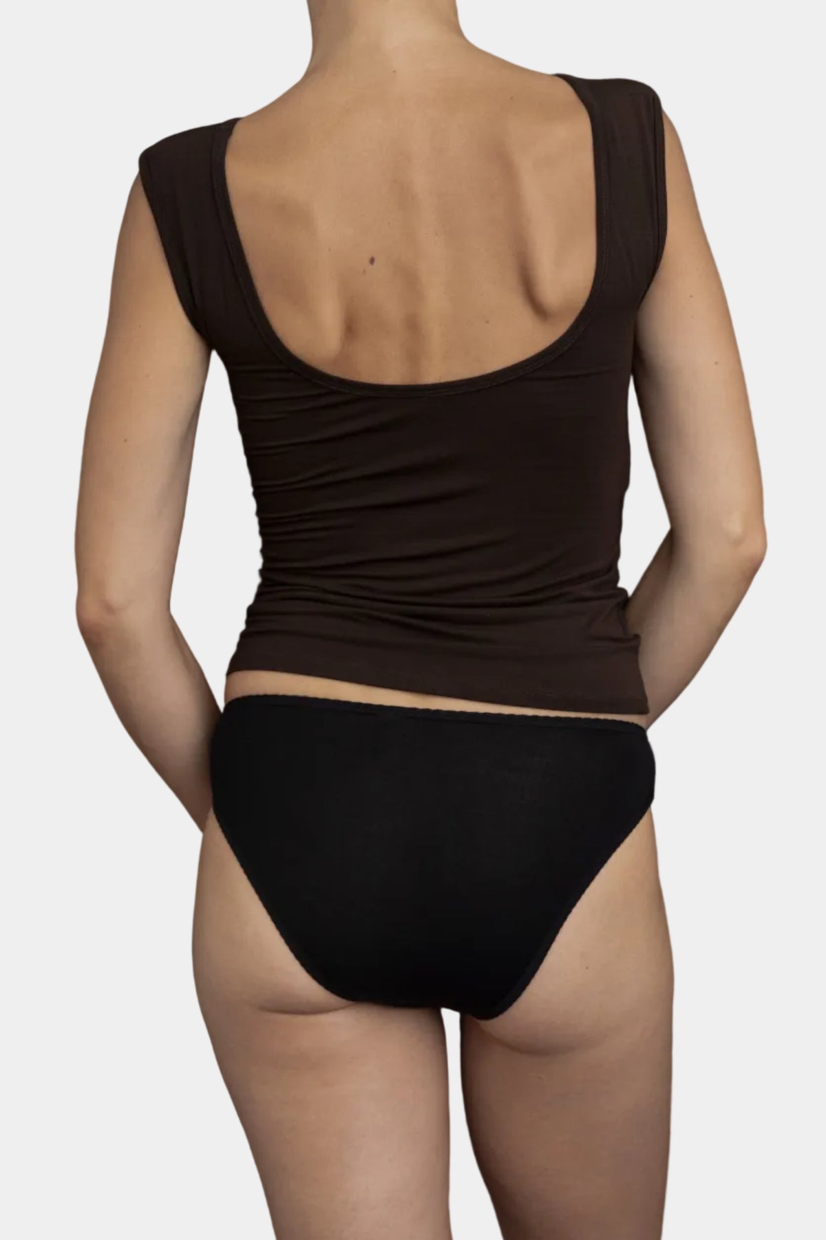 A model wearing Kye Intimates Recline Bateau sleeveless top in Espresso and recline briefs viewed from the back - East Coast General