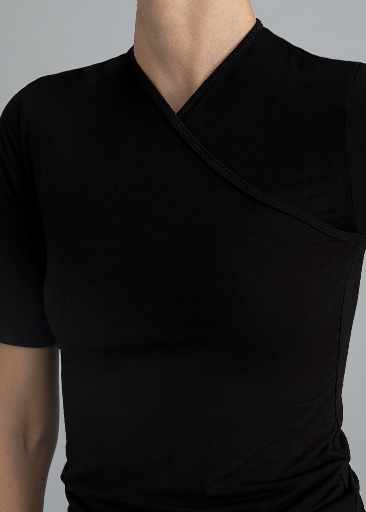 close up detail of a women wearing the Kye Intimates French sleeve top in black  - East Coast General