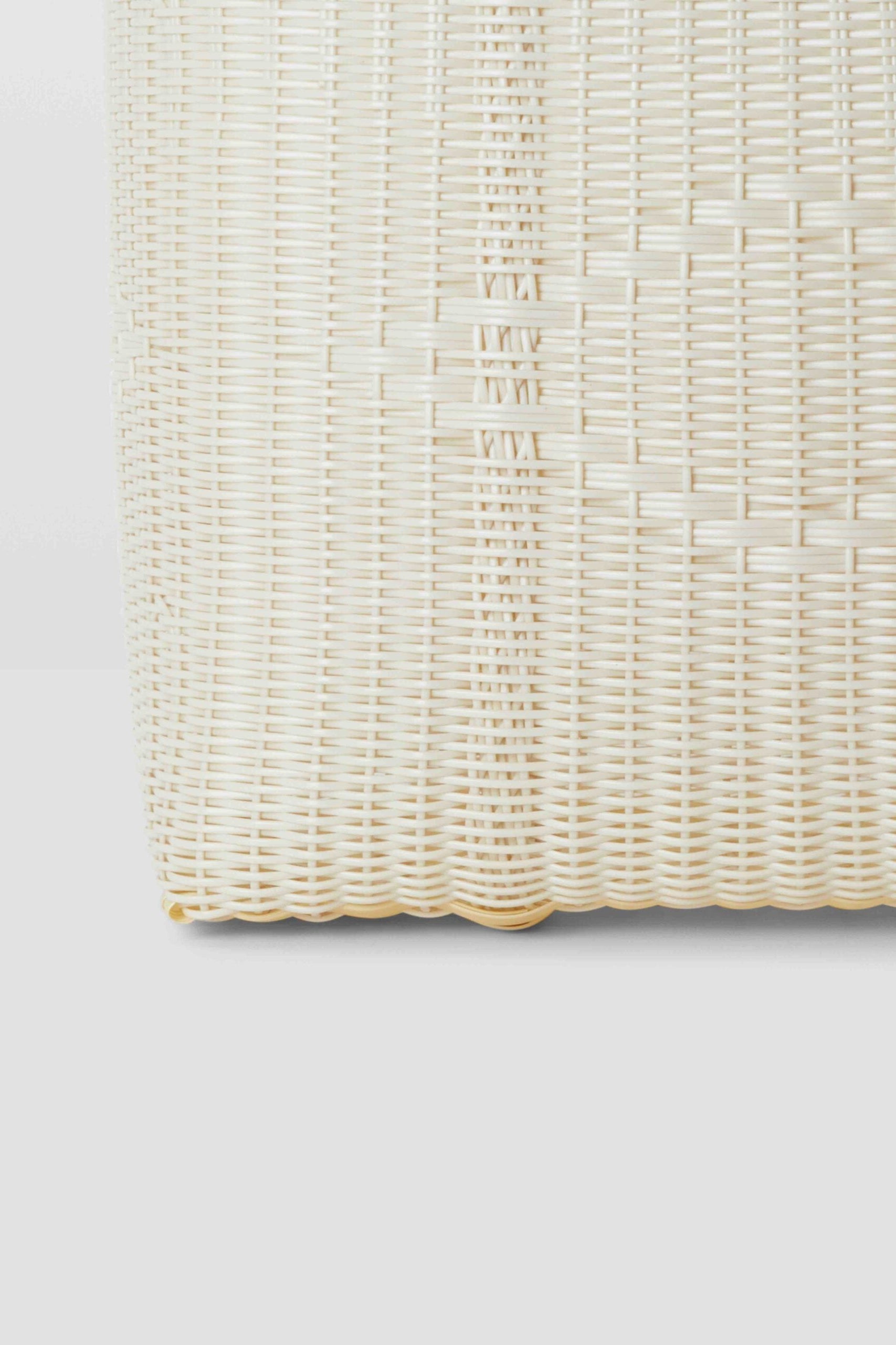 Woven beige placemat on a light gray background