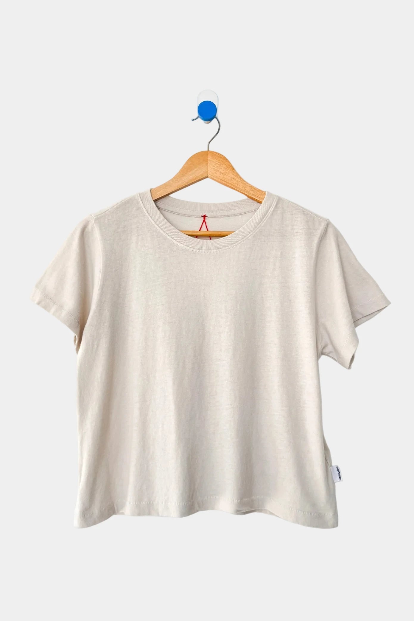 Le Bon Shoppe Airy tee in Rice, displayed on a wooden hanger - East Coast General
