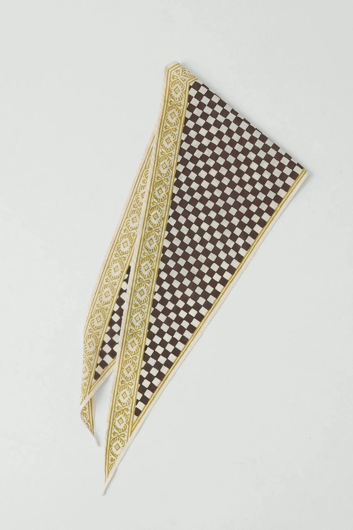 Checkered scarf with decorative border on a light gray background