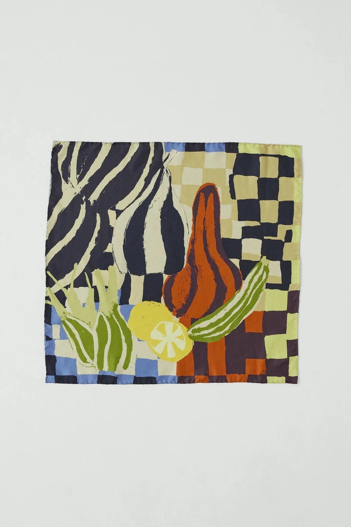 Folded fabric with geometric pattern on a light gray background