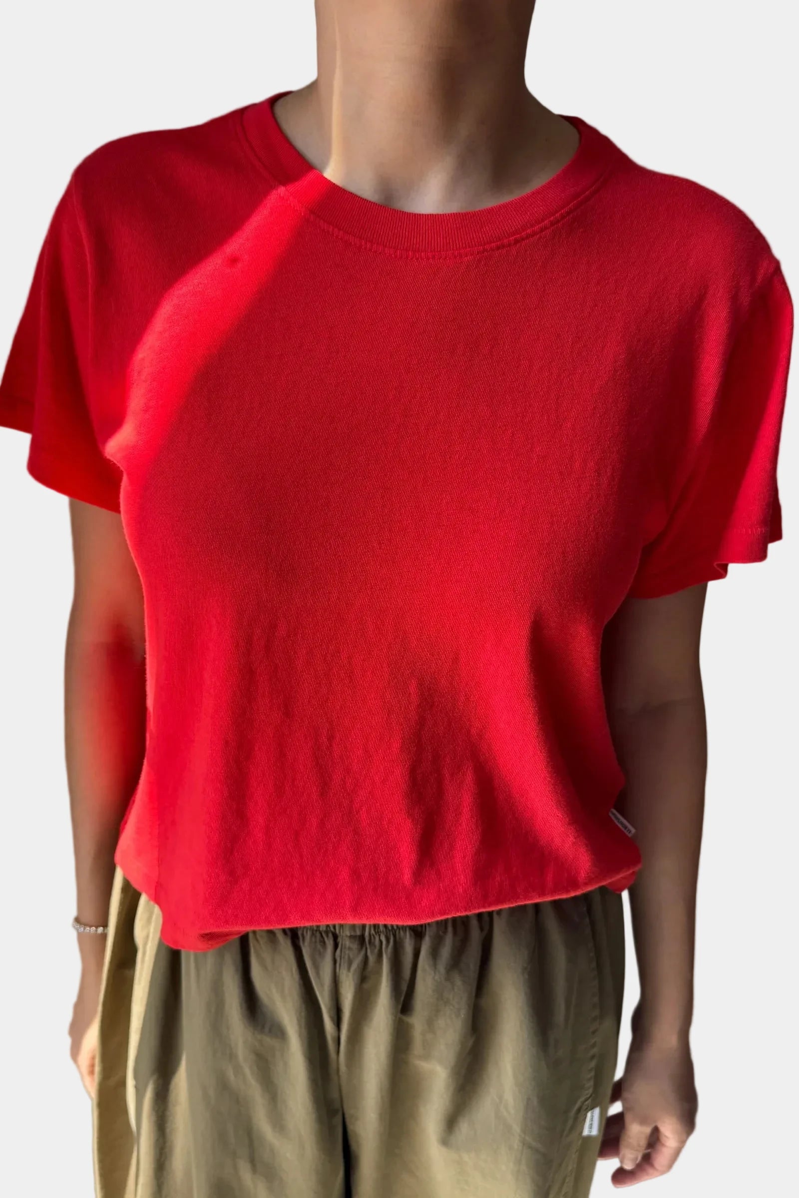 A person wearing the Le Bon Shoppe Airy Tee in tomato, viewed for the front - East Coast General