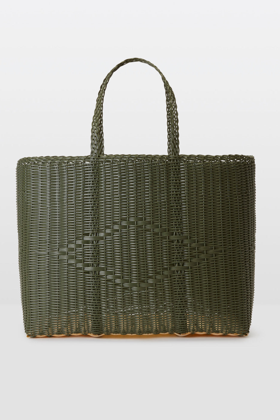 Woven green tote bag on a light gray background